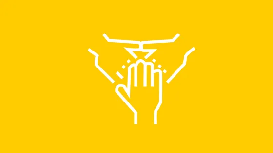 Hands on a yellow background.