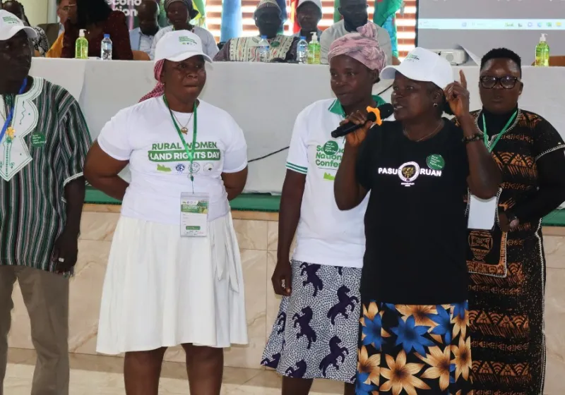 Woman speaking in a microphone at the conference